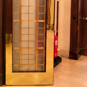 Restored door with brass protection